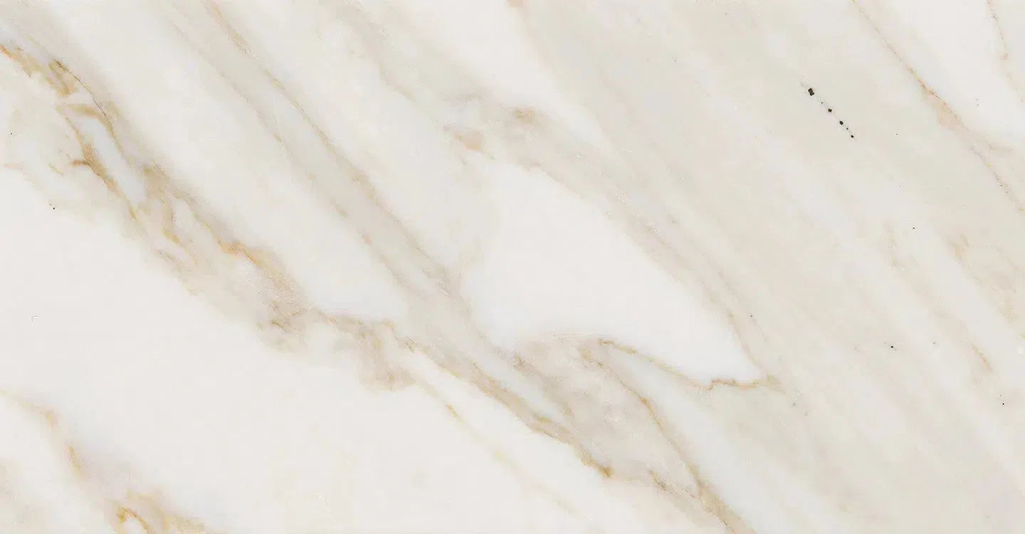 Veined marble slab from the Calacatta Gold Marble collection showcasing elegant patterns.