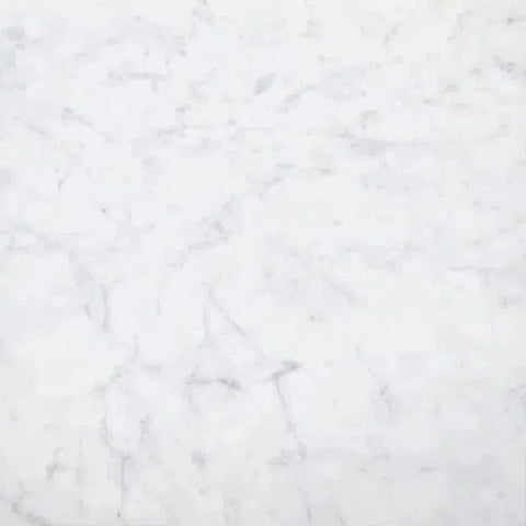 Carrara White Marble texture showcasing elegant white veining on smooth surface.