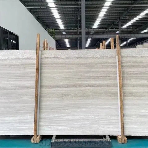 Horizontal-striped marble slab from the Haisa Light White Wood Limestone collection.