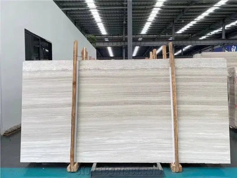 Horizontal-striped marble slab from the Haisa Light White Wood Limestone collection.