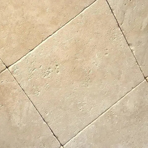 Beige Travertine tile floor in collection named Ivory Light Travertine.