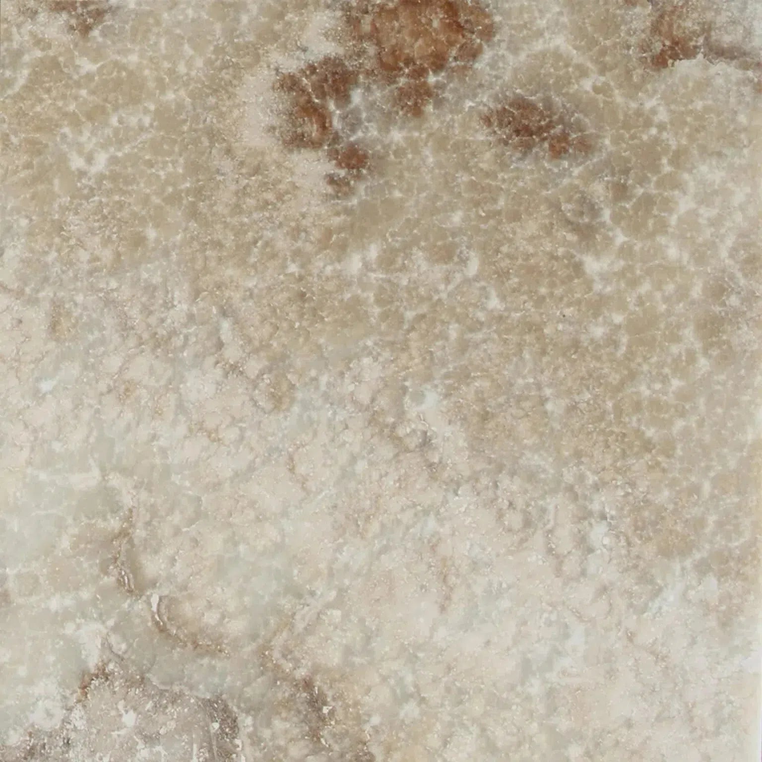 Beige and brown patterned stone from the La Travonya Travertine collection.