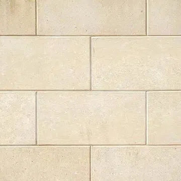 Tan brick wall featured in the Limestone collection for elegant design inspiration.