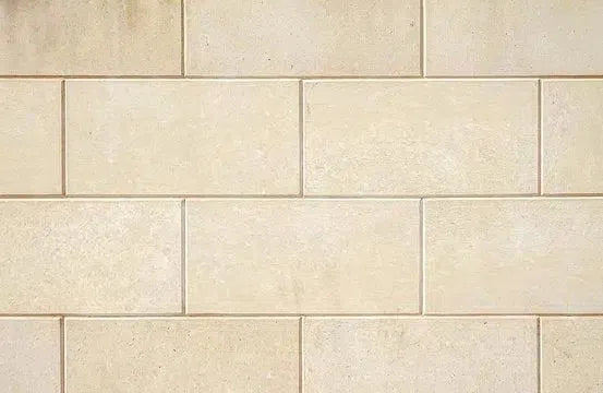 Tan brick wall featured in the Limestone collection for elegant design inspiration.