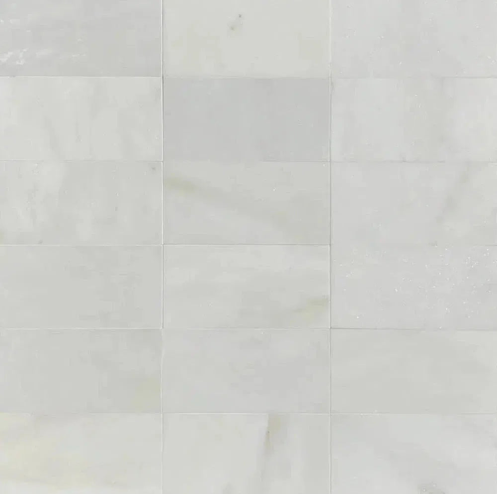 Elegant white marble tile pattern from the Oriental White (Asian Statuary) Marble collection.