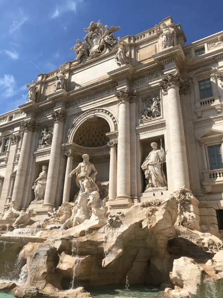 Ornate Trevi Fountain showcased in the Travertine collection of elegant architecture.