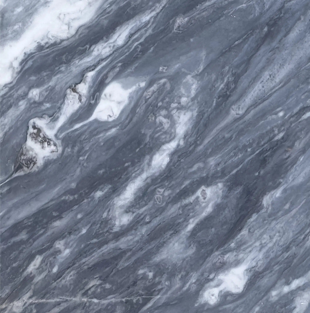 A close-up of a Bardiglio Nuvolato (Italian) 12X12 Marble Polished-Honed slab from SurfacesGalore, featuring a luxurious gray and white swirling pattern that exudes refined elegance.