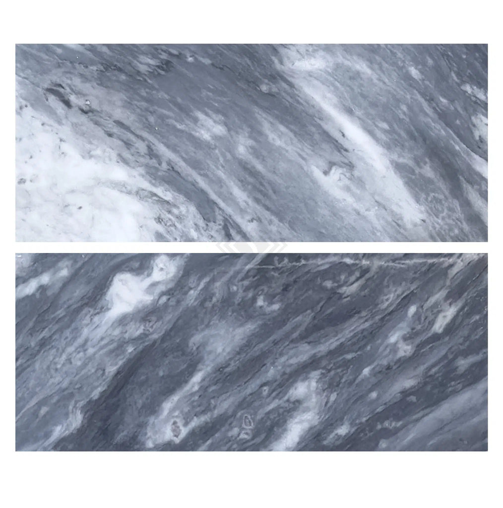 Two horizontally placed slabs of Bardiglio Nuvolato (Italian) 12X24 Marble Polished-Honed showcase the mesmerizing swirling patterns in gray and white, highlighting the quality SurfacesGalore is known for.