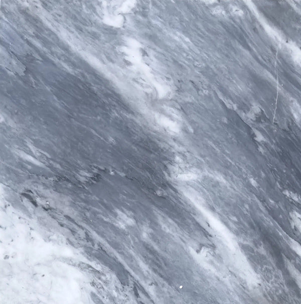 Close-up of a Bardiglio Nuvolato (Italian) 18x18 Marble Polished-Honed surface with natural veining patterns and rich gray tones, showcasing the elegance of SurfacesGalore.