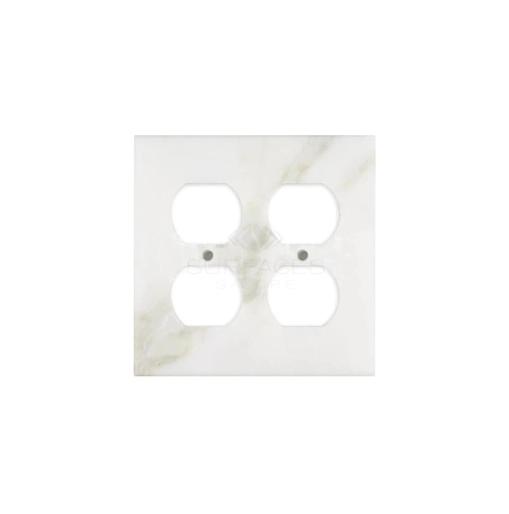 A Calacatta Gold marble double duplex switch wall plate cover with four openings, crafted from authentic natural stone by SurfacesGalore, is shown against a plain white background.