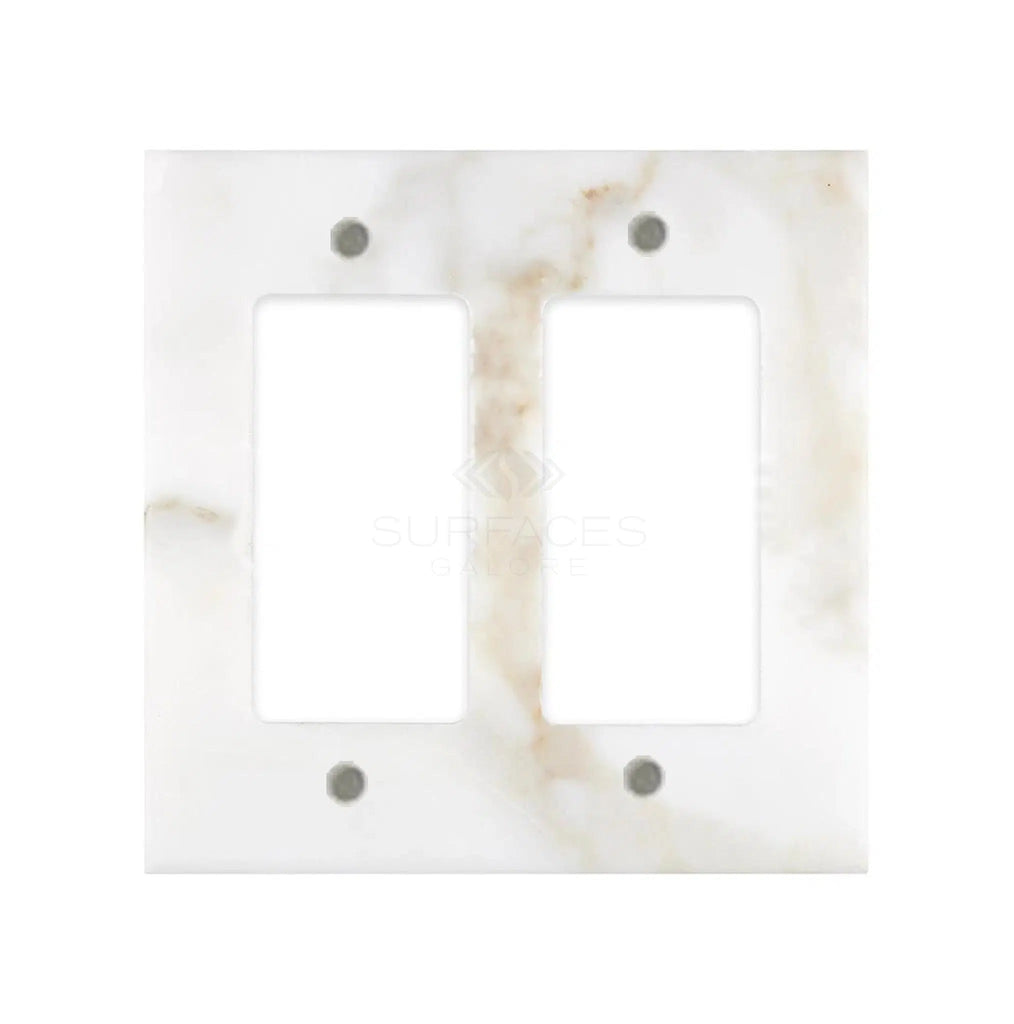 The Calacatta Gold Marble Double ROCKER Switch Wall Plate by SurfacesGalore is a luxury switch plate cover crafted from authentic marble, featuring light gray and white veining. Natural stone variations add a unique touch to this double light switch wall plate.