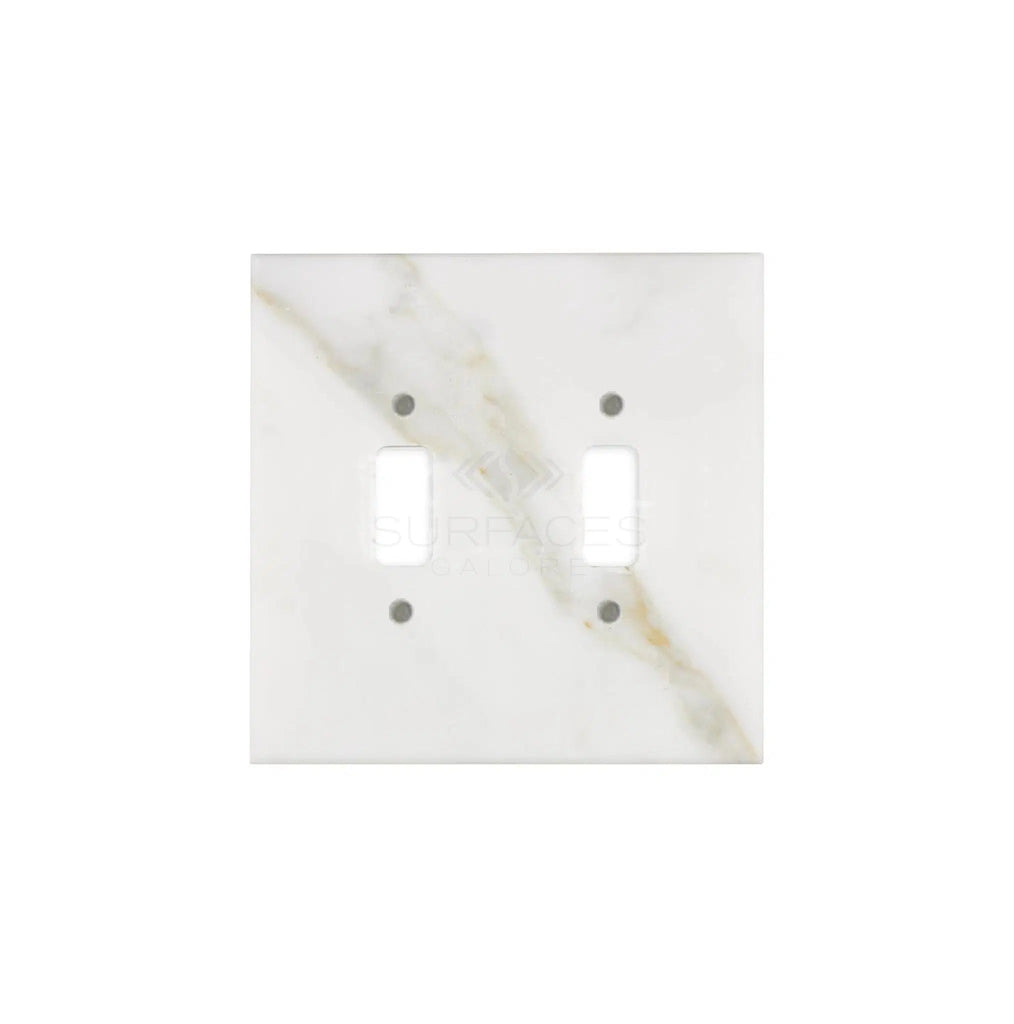 Introducing the SurfacesGalore Calacatta Gold Marble Double Toggle Switch Plate, featuring a polished finish with subtle gray veining. This luxurious cover plate is perfect for enhancing your home decor.