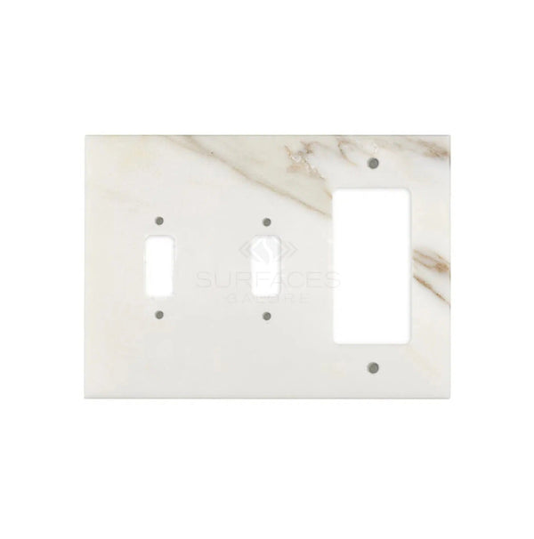 Calacatta Gold marble double toggle and rocker switch wall plate/cover plate from SurfacesGalore features a sophisticated white marble-look with one rectangular and two smaller oval openings, set against a light grey background to offer an authentic marble aesthetic.