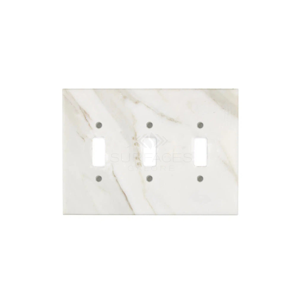 The Calacatta Gold Marble Triple Toggle Switch Plate/Cover Plate by SurfacesGalore, featuring subtle gray veining on a white marble background, adds a touch of natural stone elegance to any room.