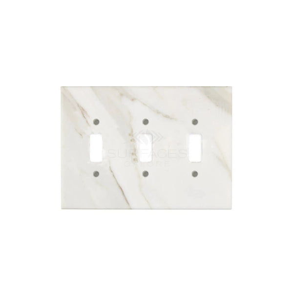 The Calacatta Gold Marble Triple Toggle Switch Plate/Cover Plate by SurfacesGalore, featuring subtle gray veining on a white marble background, adds a touch of natural stone elegance to any room.