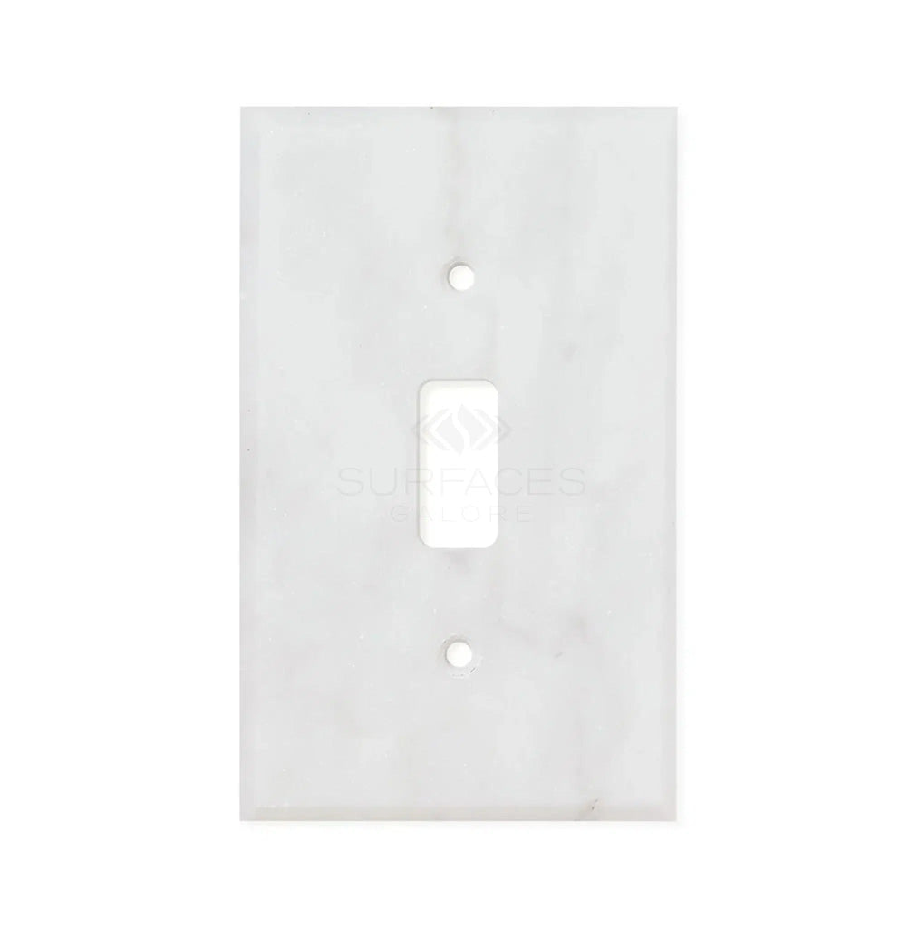 The SurfacesGalore Carrara White Marble Single Toggle Plate Switch Wall Plate, crafted from authentic natural stone, features a single switch opening and two screw holes.