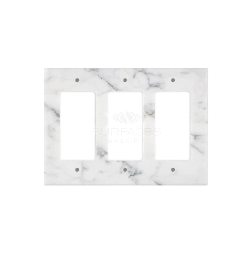 The Carrara White Marble Triple ROCKER Plate Switch Wall Plate, offered by SurfacesGalore, features a polished finish and subtle gray veining. Crafted from natural stone, this elegant switch plate adds a touch of sophistication to any room.