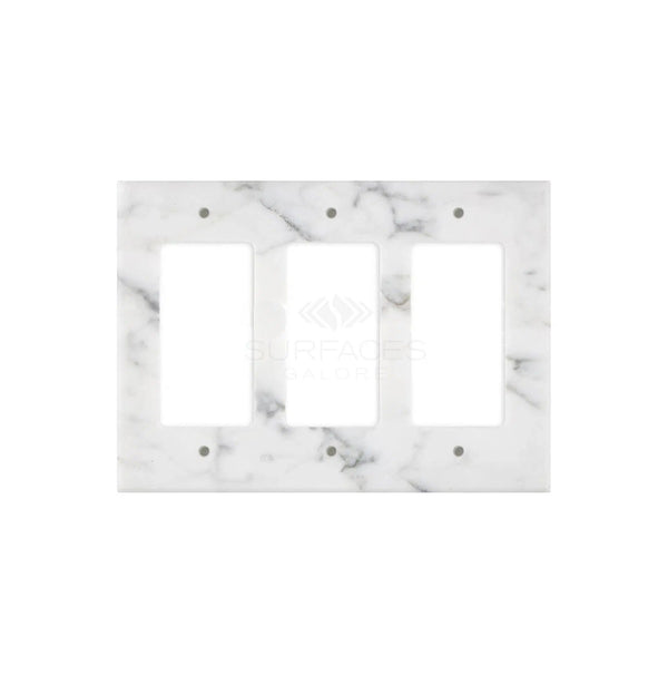 The Carrara White Marble Triple ROCKER Plate Switch Wall Plate, offered by SurfacesGalore, features a polished finish and subtle gray veining. Crafted from natural stone, this elegant switch plate adds a touch of sophistication to any room.