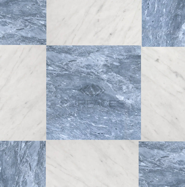 The Checkerboard Marble - Travertine Tile Bardiglio Imperiale and Bianco Carrara Marble 12X12 Set features a pattern of light and dark grey natural stone with subtle veining. Luxury Design by SurfacesGalore logo in the center.