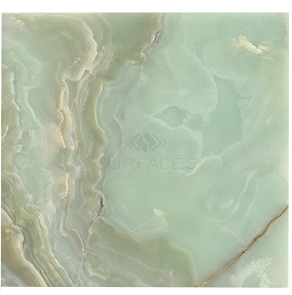 The Green Onyx Premium Marble 12X12 Polished from SurfacesGalore features a stunning marble surface with light green and beige swirls, showcasing natural elegant patterns and textures. Text on image reads "SurfacesGalore: Premium Tile Options.