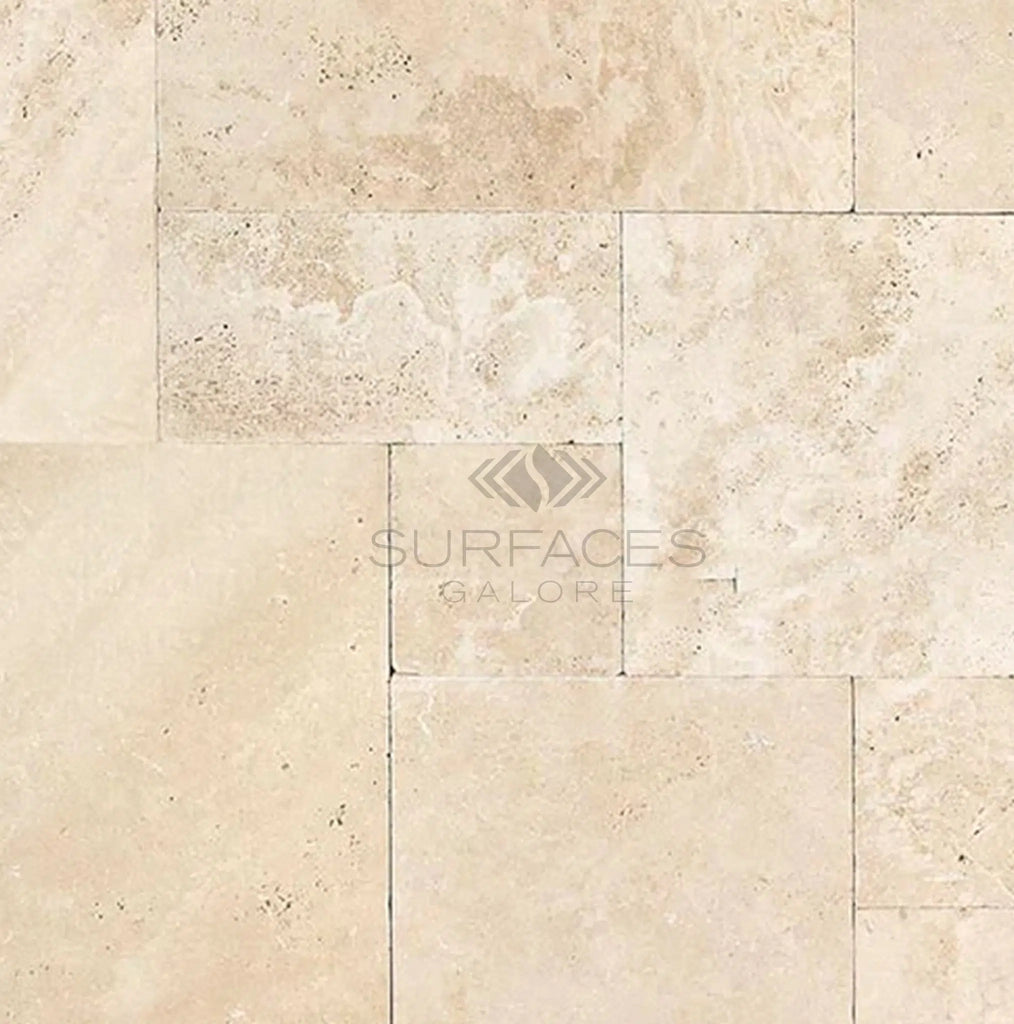 A detailed close-up of the Ivory (Light) Travertine 4 pcs Versailles Pattern/ French Pattern Set (Cross-Cut) Tumbled tiles arranged in a staggered pattern, with the SurfacesGalore logo at the center.