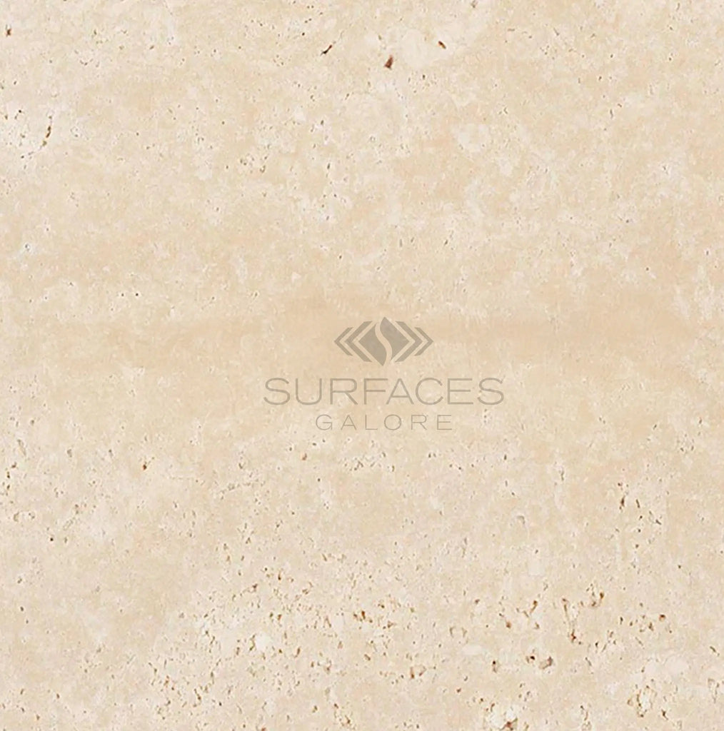 Ivory light travertine surface with subtle veining, featuring the text "SurfacesGalore" in the center, reminiscent of premium cream-colored marble.