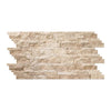 A rectangular section of beige Ivory (Light) Travertine 7X20 Ledger-Panel ("Z" Split-Panel) Split-Faced tiles from SurfacesGalore, arranged in an interlocking pattern. These tiles create a textured surface with a slightly rugged appearance, showcasing varied depth and natural stone colors.