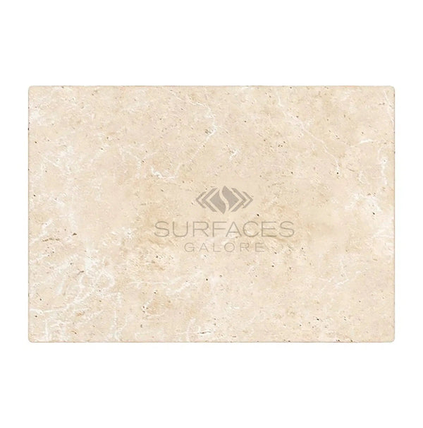 An Ivory (Light) Travertine 8x16 (Cross-Cut) Tumbled tile with a subtle texture, featuring the SurfacesGalore logo in the center, reminiscent of Light Travertine.