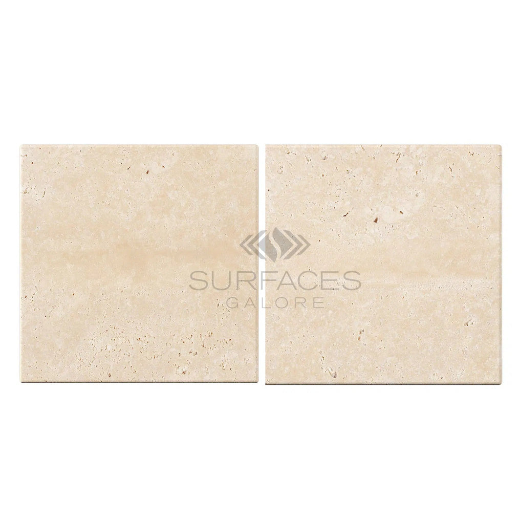 Two Ivory (Light) Travertine 8X8 (Cross-Cut) Tumbled tiles side by side with the text "SurfacesGalore" overlayed in the center.