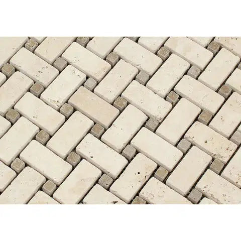 A close-up of the Ivory (Light) Travertine Basketweave w/ Noce Dots Mosaic Filled and Honed by SurfacesGalore. The tiles are intricately arranged, small, and rectangular with varying shades of beige and cream, featuring a slightly rough texture that gives a natural stone appearance.