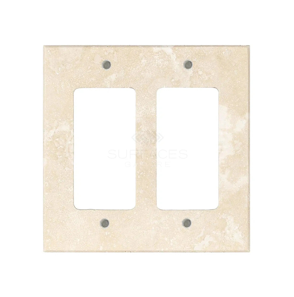 An Ivory (Light) Travertine Double ROCKER Switch Wall Plate/Cover Plate/Switch Plate, crafted by SurfacesGalore, features two rectangular openings and four screw holes, making it perfect for luxury home decor.