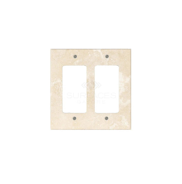 The Ivory (Light) Travertine Double ROCKER Switch Wall Plate by SurfacesGalore features a stone-like texture and four screw holes, seamlessly blending luxury home decor with practicality.