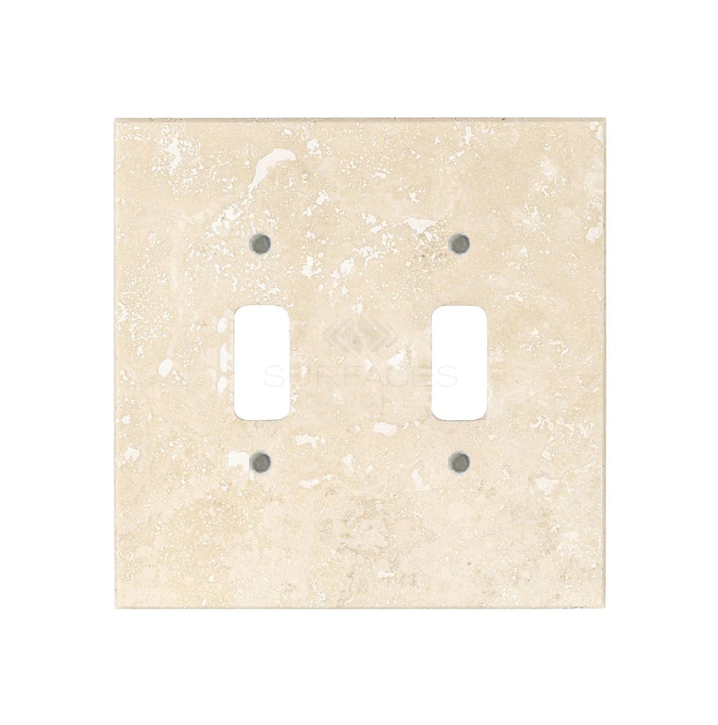 An ivory (light) travertine double toggle switch plate from SurfacesGalore, perfect for those seeking natural stone switch covers to elevate their luxury home decor.