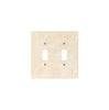 The SurfacesGalore Ivory (Light) Travertine Double TOGGLE Plate Switch Wall Plate boasts a luxurious square design with two vertical switch openings, crafted from authentic travertine stone in a beautiful beige finish—perfect for upscale home decor.