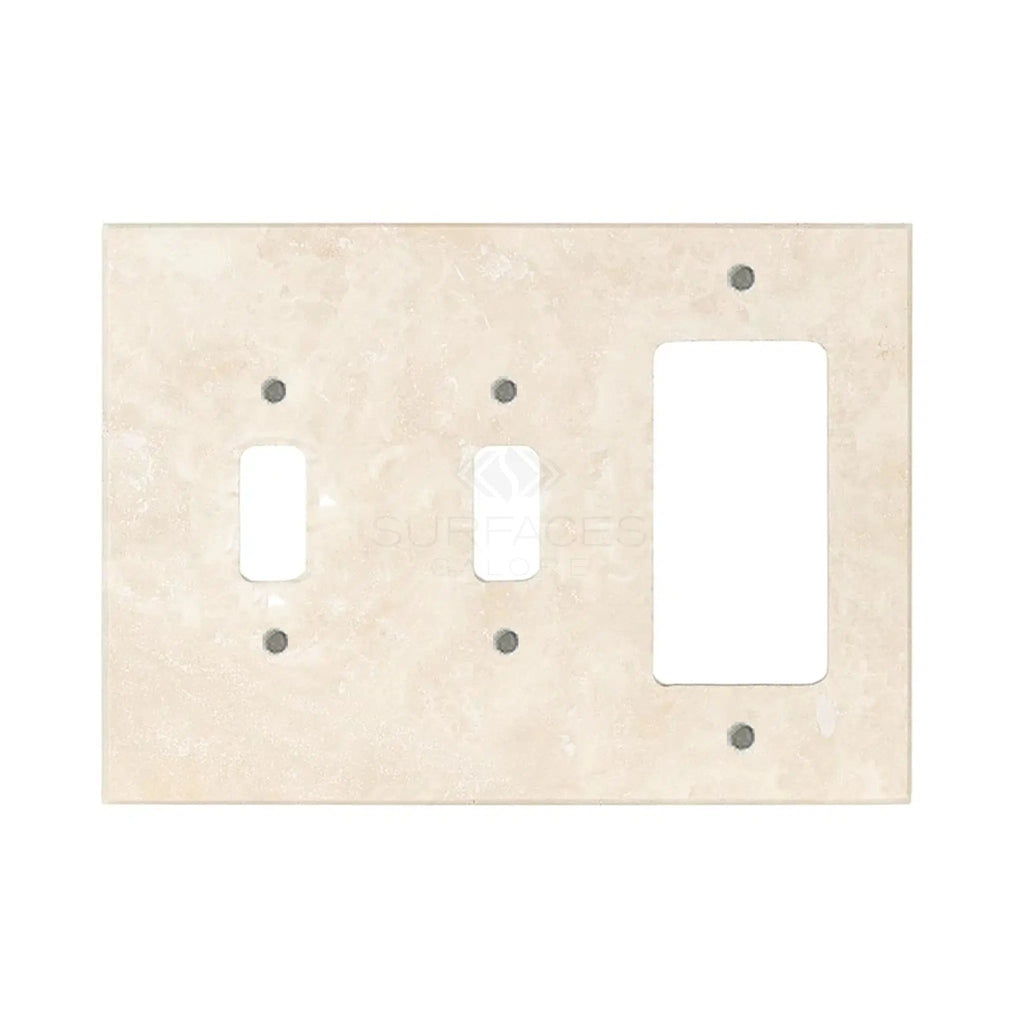 Ivory light travertine wall plates from SurfacesGalore, featuring openings for a toggle switch and a rectangular outlet, with a smooth and polished finish that mimics authentic marble.