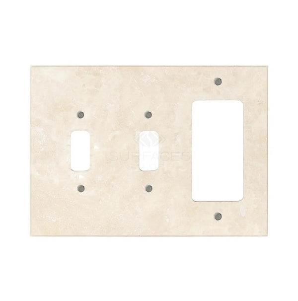 Ivory light travertine wall plates from SurfacesGalore, featuring openings for a toggle switch and a rectangular outlet, with a smooth and polished finish that mimics authentic marble.