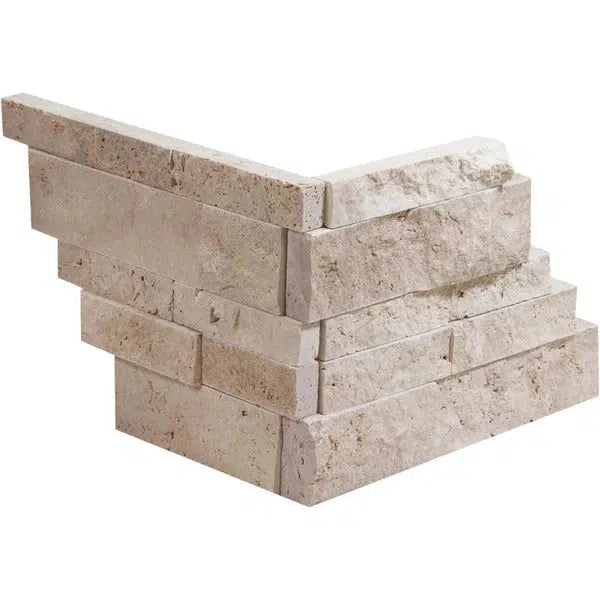 A corner section of SurfacesGalore's Ivory (Light) Travertine Ledger-Panel ("Z" Split-Panel) CORNER Split-Faced. The stone blocks are arranged in a staggered pattern, creating a textured look suitable for use in exterior walls or interior decorative features.