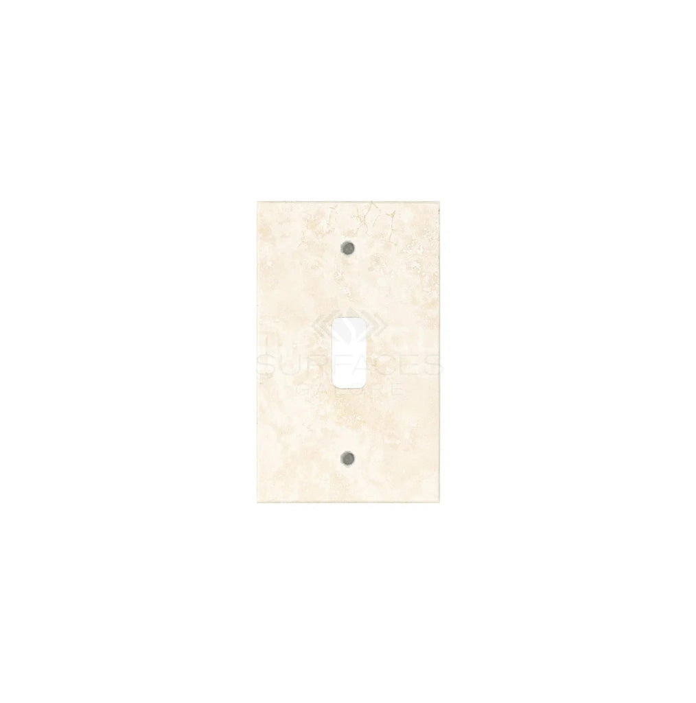 An Ivory (Light) Travertine Single TOGGLE Plate Switch Wall Plate/Cover Plate/Switch Plate by SurfacesGalore, featuring a rectangular cutout and two screw holes, designed to seamlessly blend with authentic marble wall plate covers.