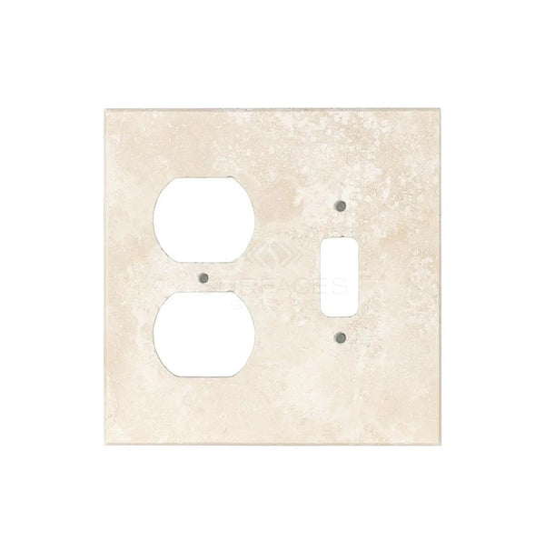 An Ivory (Light) Travertine TOGGLE - DUPLEX Switch Wall Plate from SurfacesGalore, featuring two outlet openings and one switch opening, reflecting the elegance of authentic marble wall plates, against a plain background.