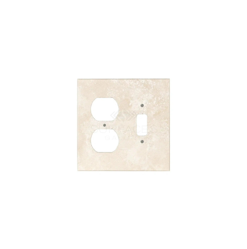 Introducing the Ivory (Light) Travertine TOGGLE - DUPLEX Switch Wall Plate from SurfacesGalore, featuring two socket openings and one switch opening with stunning natural stone variations on an ivory background.