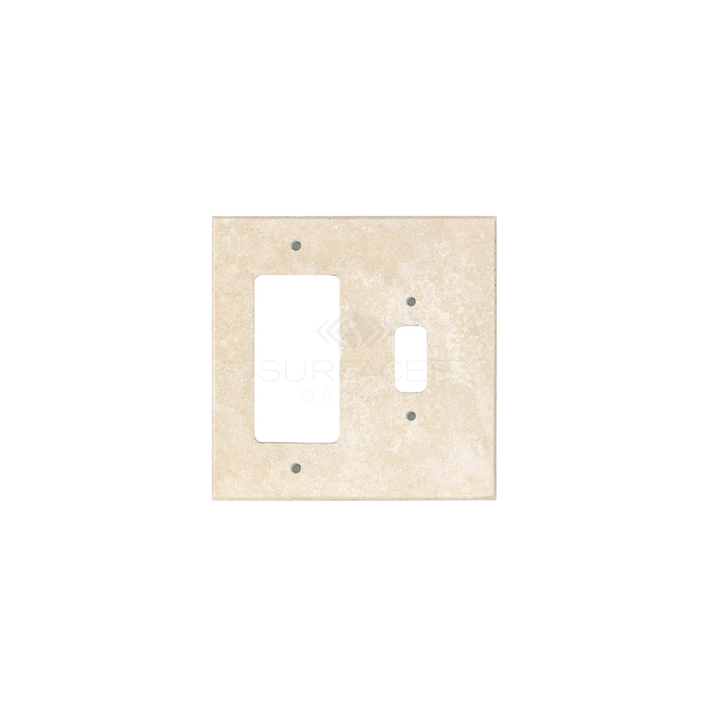 An ivory (light) travertine wall plate with one toggle and one rocker cutout, perfect for those seeking stylish switch plate covers from SurfacesGalore.