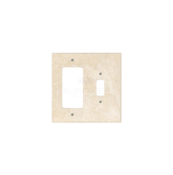 An ivory (light) travertine wall plate with one toggle and one rocker cutout, perfect for those seeking stylish switch plate covers from SurfacesGalore.