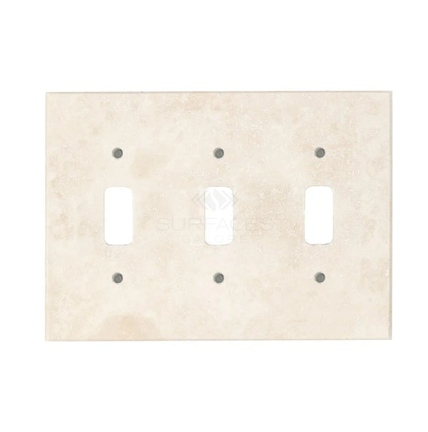 The Rectangular stone faceplate from SurfacesGalore features slots for three light switches and six surrounding screw holes, displayed against a white background, highlighting the authentic marble appearance and natural stone variations of the Ivory (Light) Travertine Triple TOGGLE Switch Wall Plate/Cover Plate/Switch Plate.