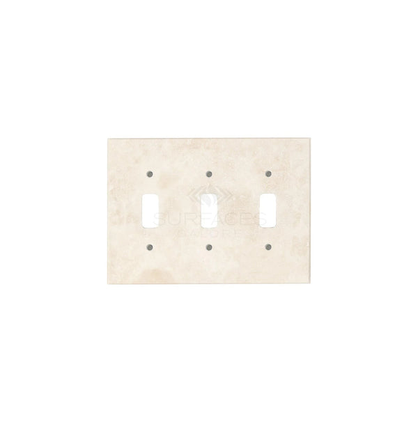 The Ivory (Light) Travertine Triple TOGGLE Switch Wall Plate from SurfacesGalore features three rectangular cutouts for switches and six screw holes, showcasing authentic marble with natural stone variations.