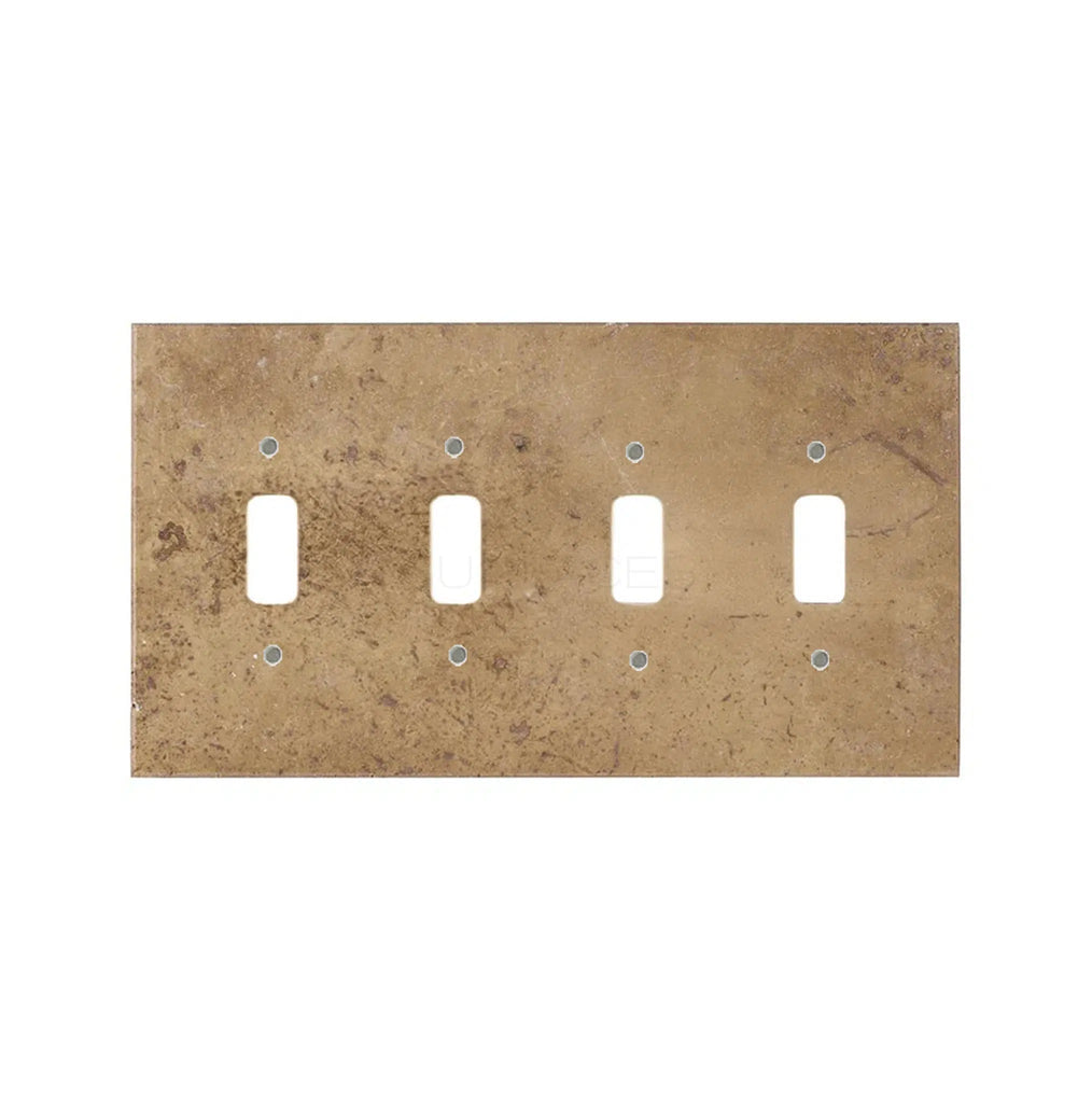 The Noce Travertine 4 Gang TOGGLE Switch Wall Plate from SurfacesGalore features a light brown, rustic, textured finish with natural stone variations and a rectangular shape.