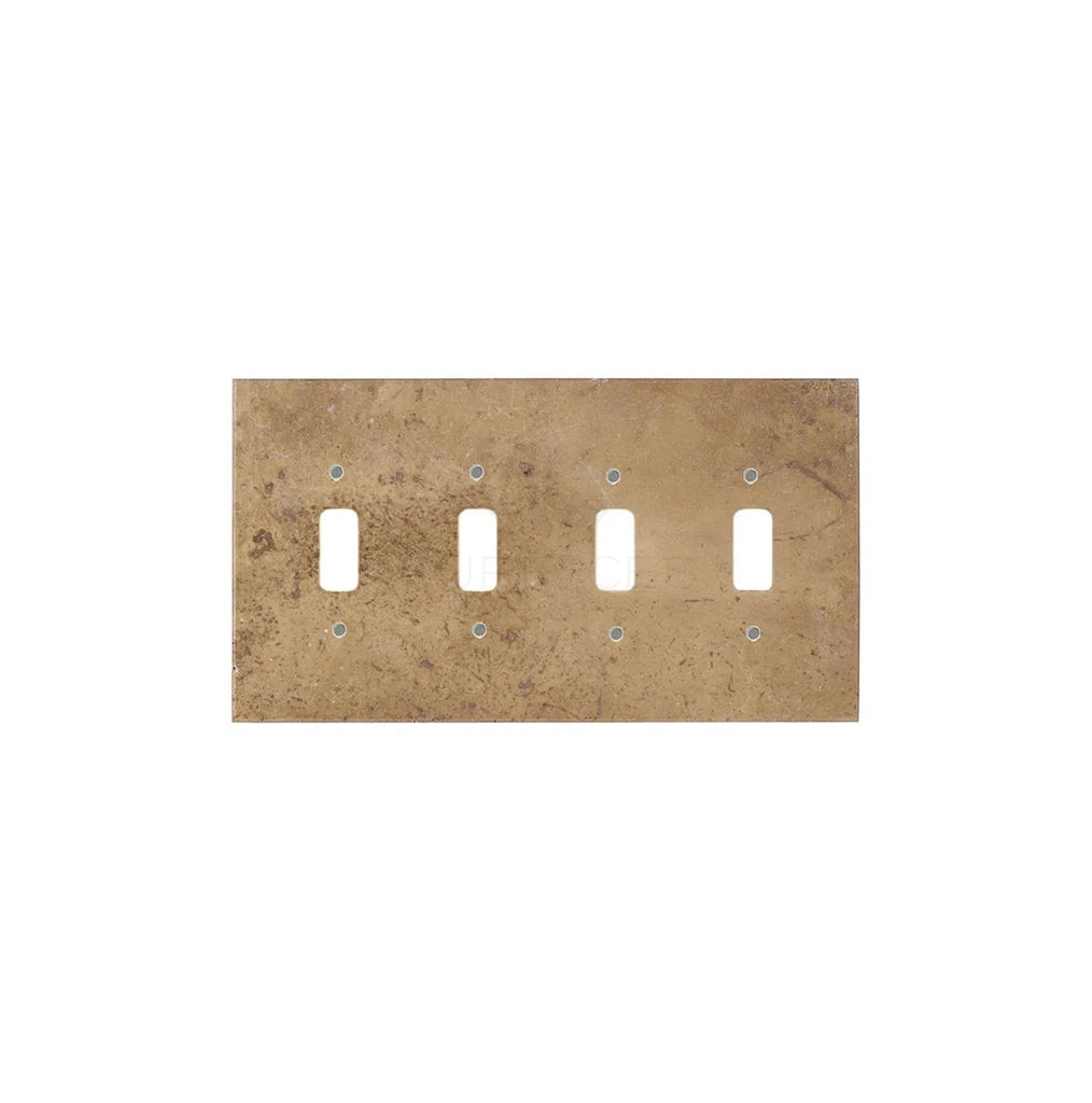 A Noce Travertine 4 Gang TOGGLE Switch Wall Plate by SurfacesGalore, featuring a slightly tarnished finish with mounting screw holes, reminiscent of authentic wall plates that showcase natural stone variations.