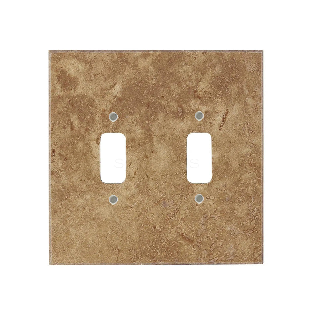 The Noce Travertine Double TOGGLE Plate Switch Wall Plate by SurfacesGalore features a brown, stone-like texture and two rectangular openings. This luxury switch plate cover adds an elegant touch, reminiscent of authentic marble wall plates.