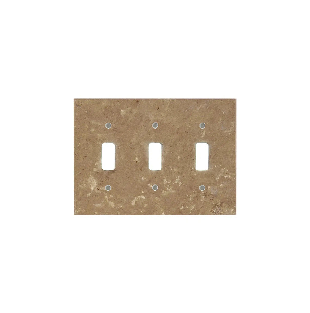 A Noce Travertine triple toggle plate switch cover plate from SurfacesGalore, made from authentic marble in a speckled beige design, featuring spaces for three switches against a white background.