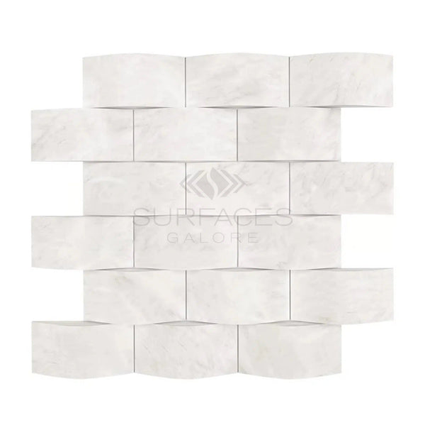 A white, wavy mosaic pattern featuring a mix of rectangular and curved tiles crafted from durable Oriental White / Asian Statuary marble, part of the SurfacesGalore collection.