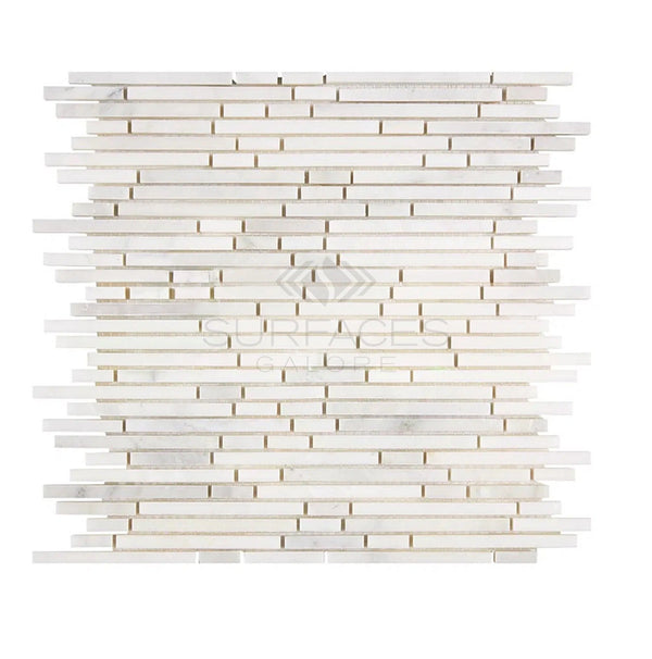 An arrangement of thin, white rectangular tiles stacked horizontally, creating a mosaic pattern on a flat surface from SurfacesGalore features the Oriental White / Asian Statuary Bamboo Sticks (Single-Color/Oriental White) Marble Mosaic Polished-Honed for a truly luxurious touch.